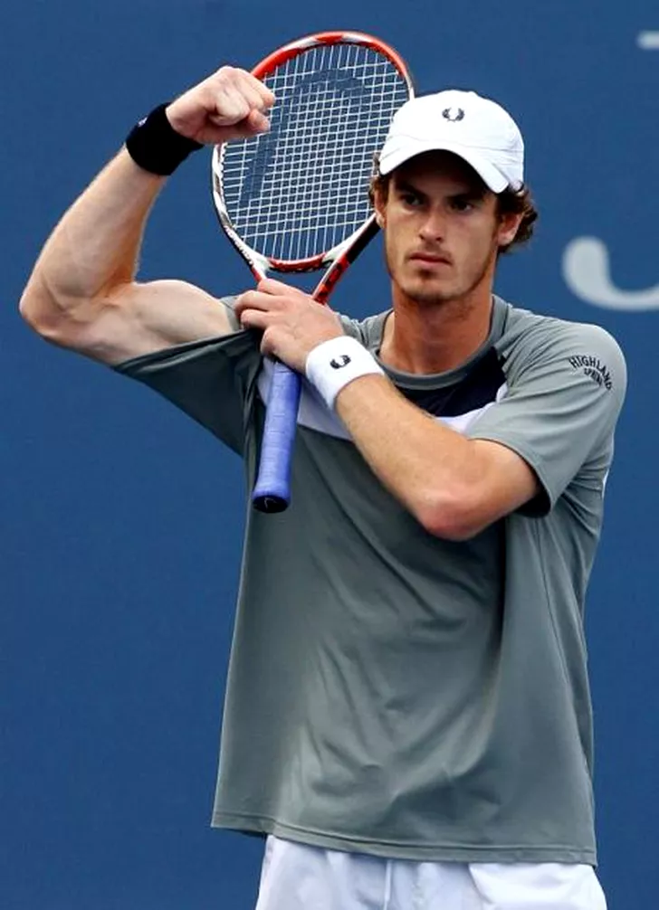 Andy Murray flexes his biceps