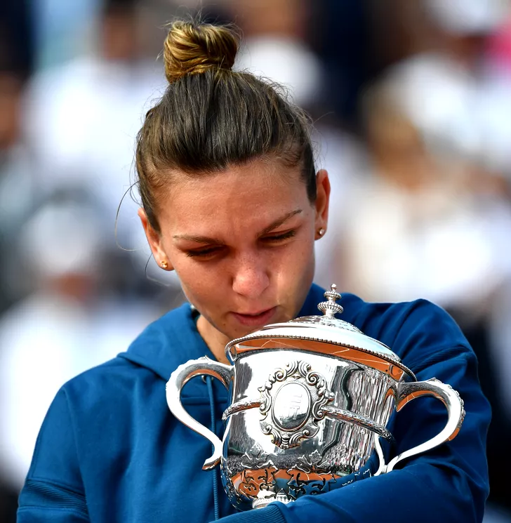 PARIS, FRANCE - JUNE 09: Simona Halep of Romania holds championship trophy after winning her French Open finals match against Sloane Stephens (not seen) of the USA at Roland Garros Stadium in Paris, France on June 09, 2018. Mustafa Yalcin / Anadolu Agency