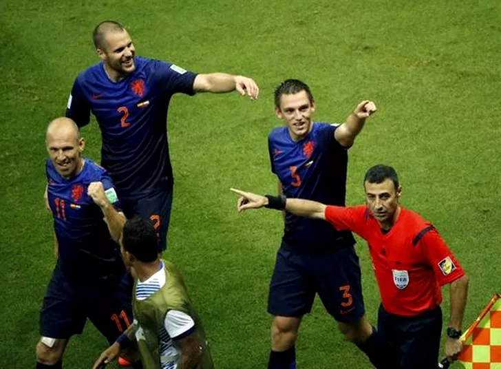 Netherlands players celebrate Veltman's goal against Spain during their 2014 World Cup Group B soccer match at the Fonte Nova arena in Salvador