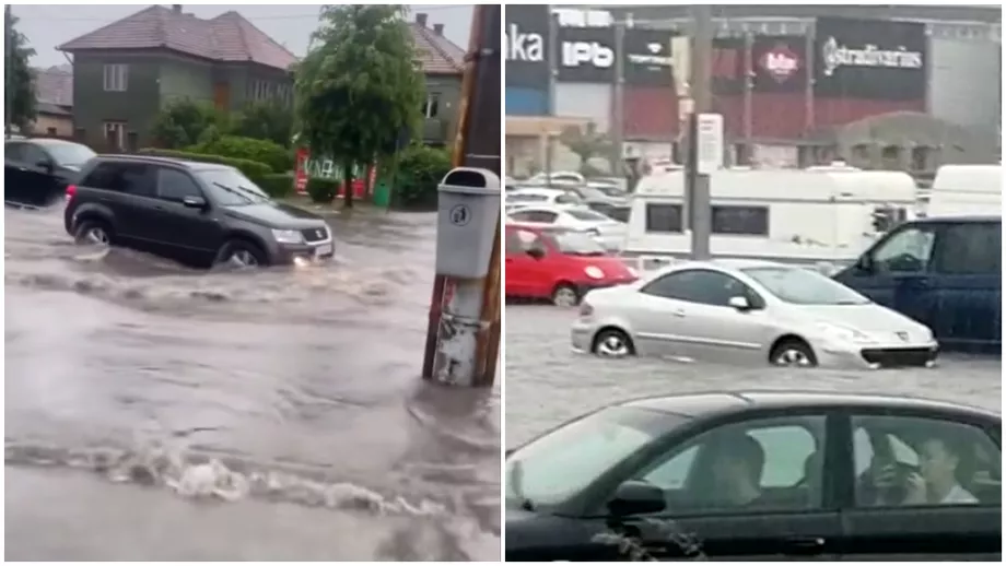 Mai multe strazi din Cluj inundate dupa o rupere de nori Masini blocate in parcarea unui mall Video